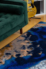 Load image into Gallery viewer, closeup-of-green-couch-and-blue-geode-crystal-area-rug-in-modern-living-room