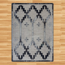 Load image into Gallery viewer, brown-and-teal-geometric-area-rug-on-wood-floor