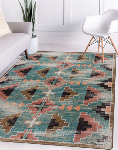 southwestern-inspired-blue-pink-geometric-area-rug-in-modern-white-room